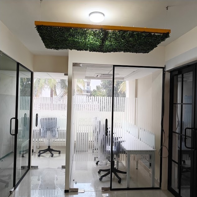 Glass-walled cabin at 43 Workspace