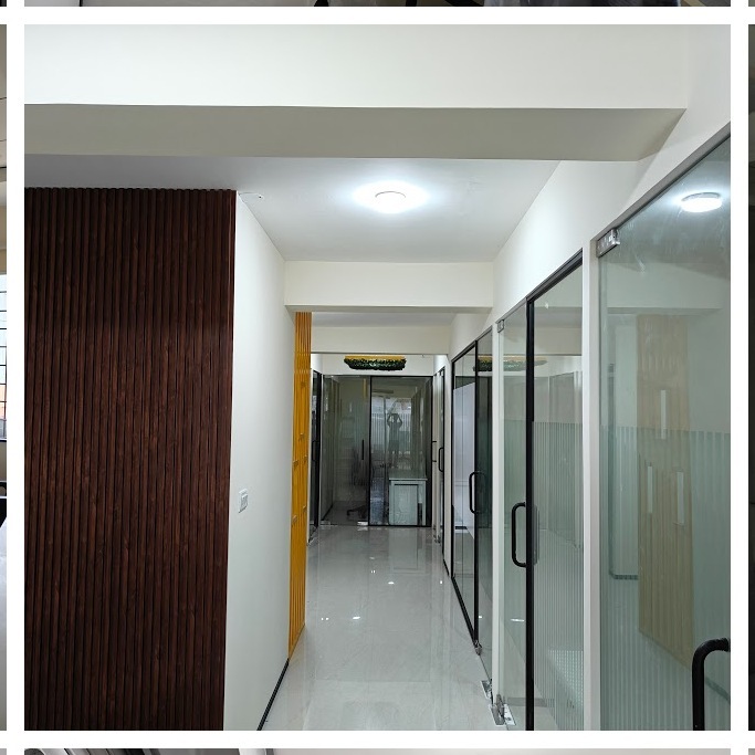 Hallway with wood panel accent at 43 Workspace